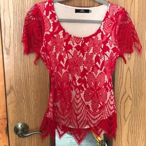 BKE Boutique lacey top with back cut-out.